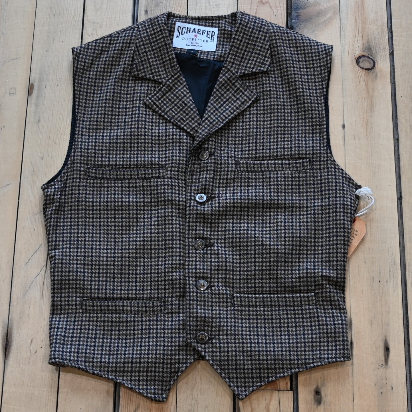 View of Schaefer Laramie vest in assorted wool-blend patterns with Western lapels and four-pocket design