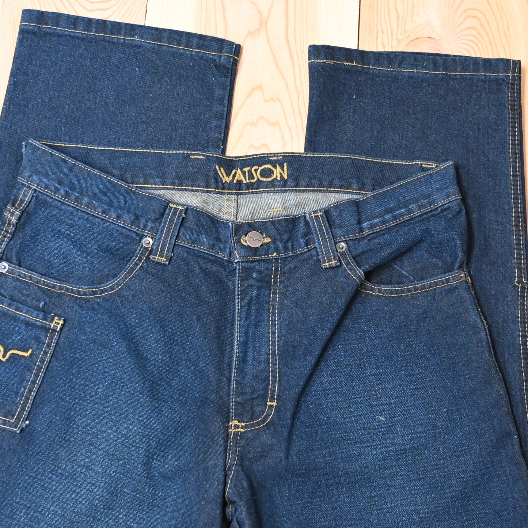 View of Kimes Ranch Watson jeans in Dark Indigo featuring hand-sanded details and bootcut leg