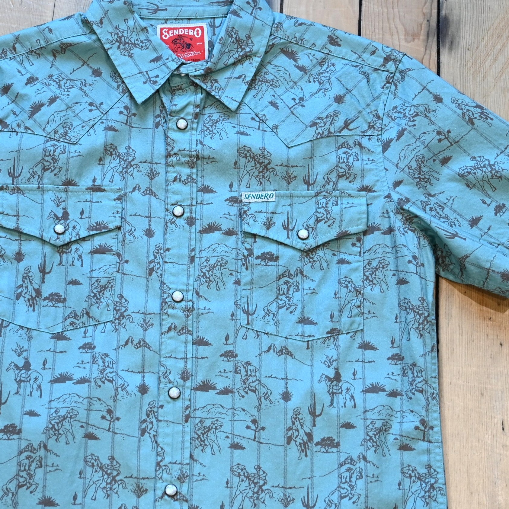 View of Sendero short sleeve pearl snap shirt in Azulado Desert Rodeo serape print