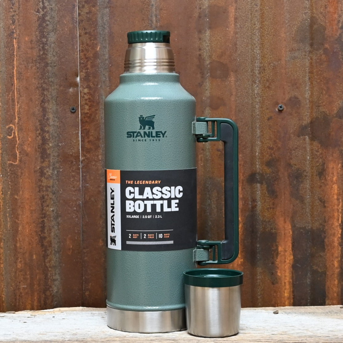 Stanley Legendary Classic Bottle 48 oz in Hammertone Green with twist-pour stopper and collapsible handle