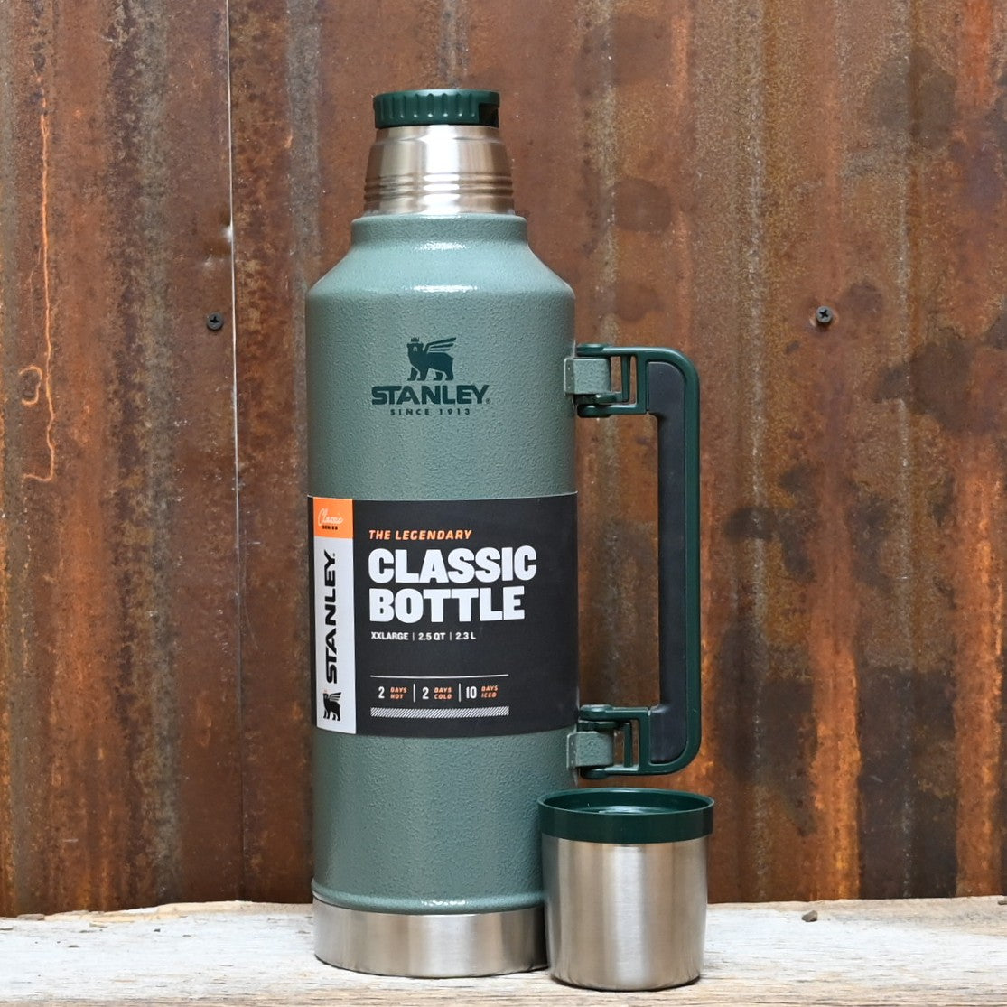 Stanley Legendary Classic Bottle 48 oz in Hammertone Green with twist-pour stopper and collapsible handle