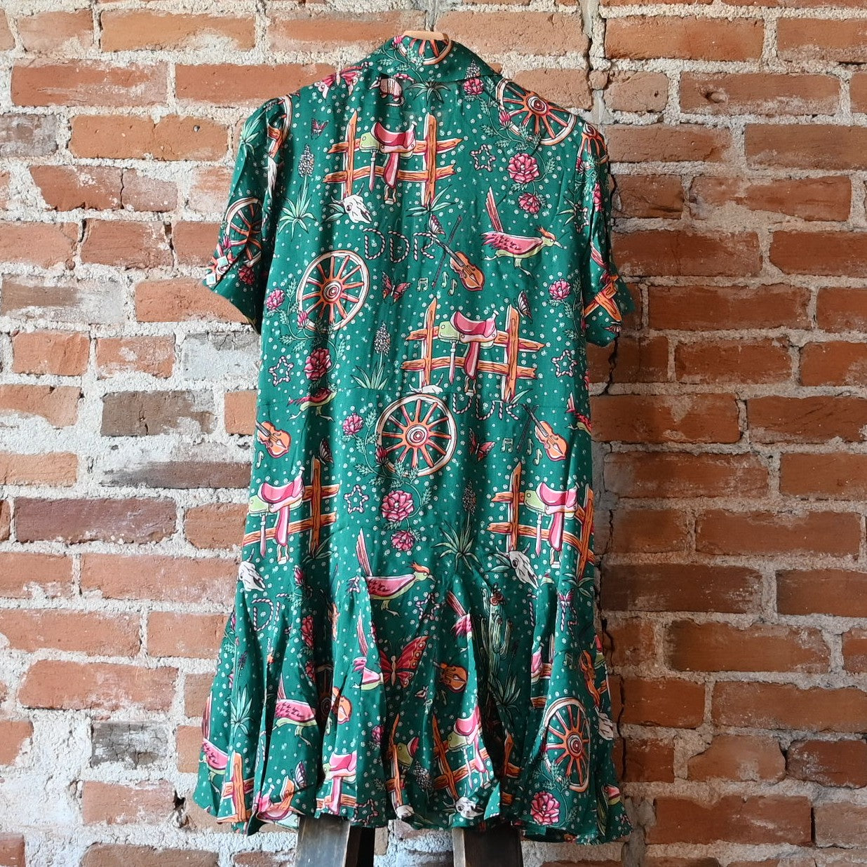 View of Double D Ranch Rhinestone Suits & Cowboy Boots Dress featuring custom Western print, faux-turquoise buttons, and pearl snaps in a relaxed fit