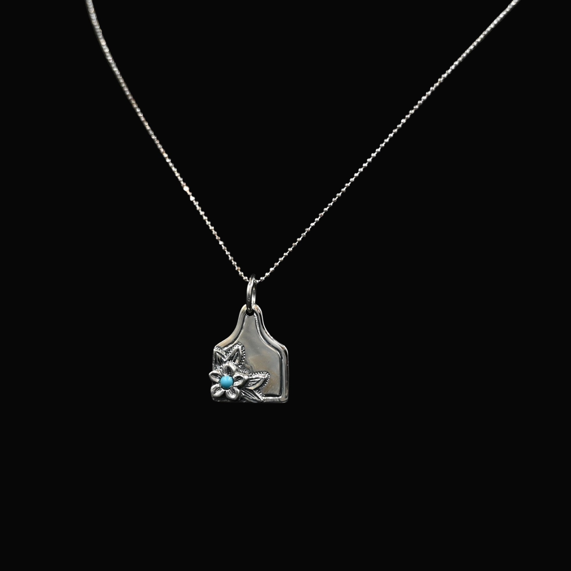 Vogt Turquoise Blossom eartag pendant in sterling silver with turquoise stone and floral motif