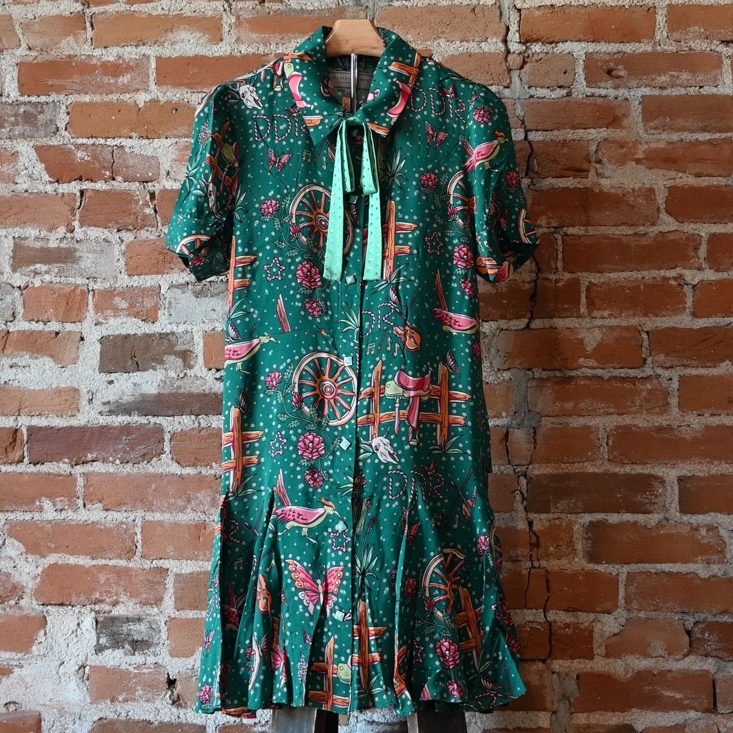 View of Double D Ranch Rhinestone Suits & Cowboy Boots Dress featuring custom Western print, faux-turquoise buttons, and pearl snaps in a relaxed fit