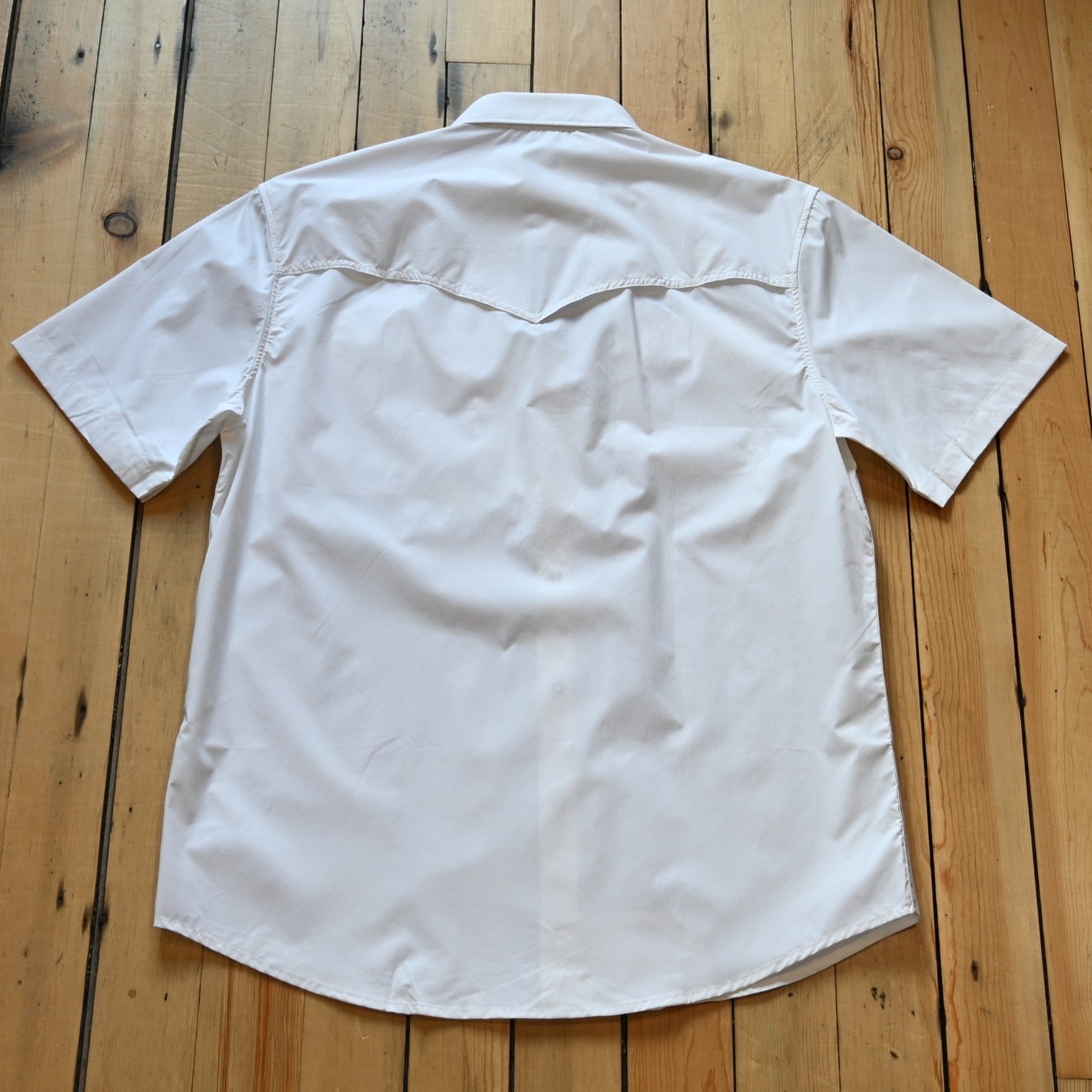View of White short sleeve RangeTek Western snap shirt with mesh ventilation and security pocket