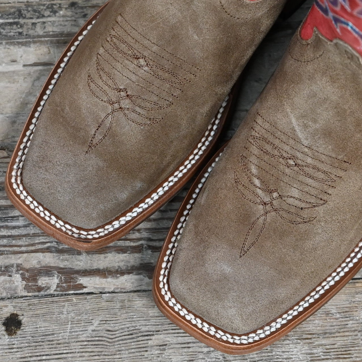 View of Macie Bean 12″ “Cowpunchin Karlee” boot with red shaft, sand suede vamp, and cutter toe