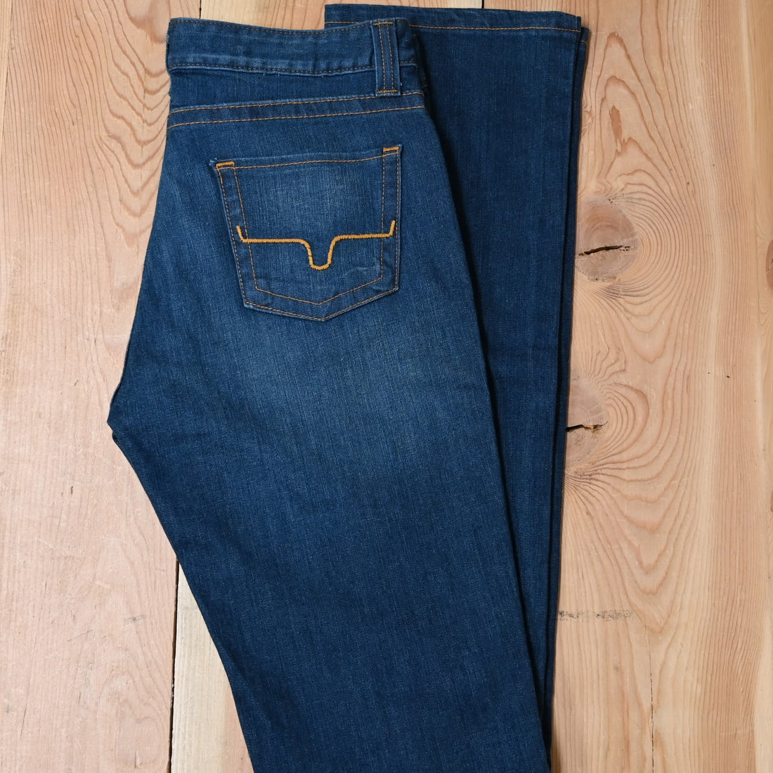 View of Kimes Ranch Betty17 Jeans in Blue, featuring embroidered horns on back pockets and a modest bootcut leg