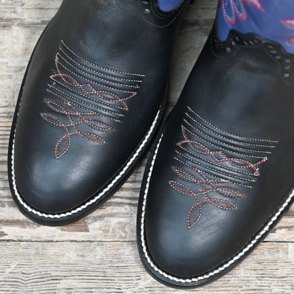 View of Hondo 14" cowboy boot with purple top, black retan vamp, medium round toe, and spur ledge