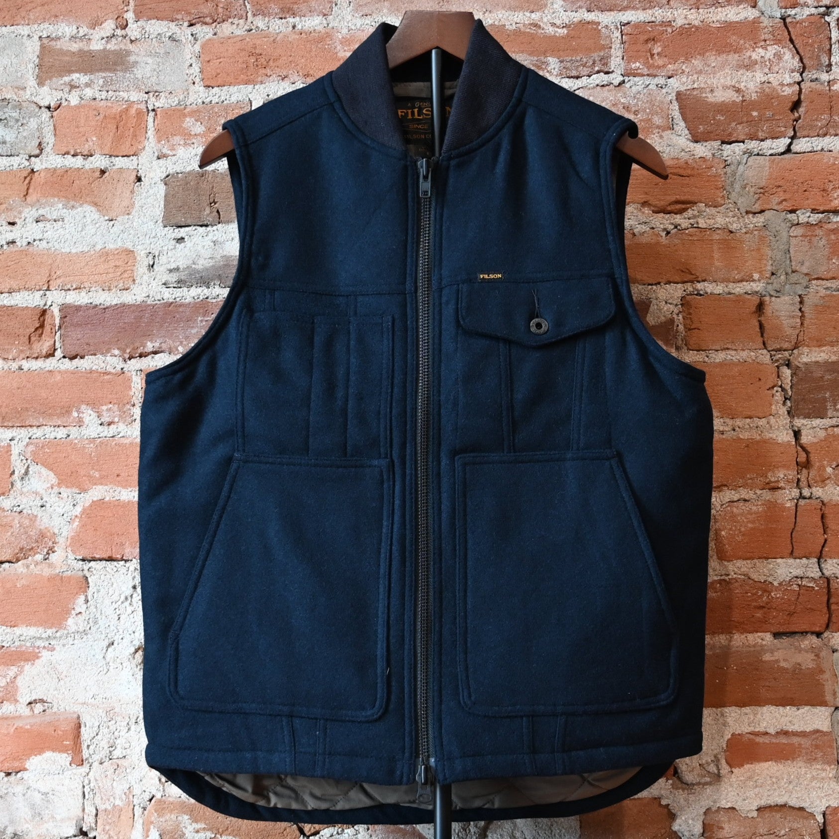Filson Spokane insulated work vest in navy wool-blend with quilted insulation and utility pockets