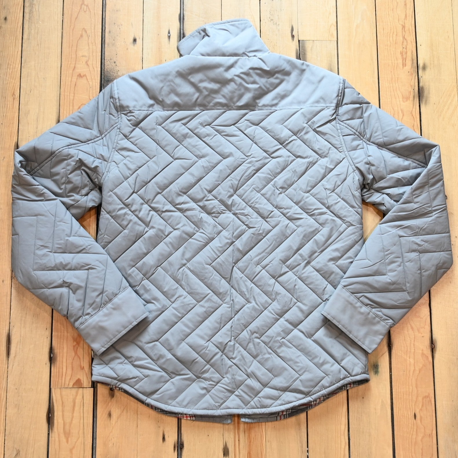 Kimes Ranch men’s Skink quilted jacket with zig-zag pattern, chest flap pockets, and longhorn embroidery