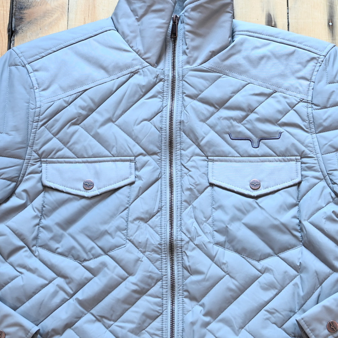 Kimes Ranch men’s Skink quilted jacket with zig-zag pattern, chest flap pockets, and longhorn embroidery