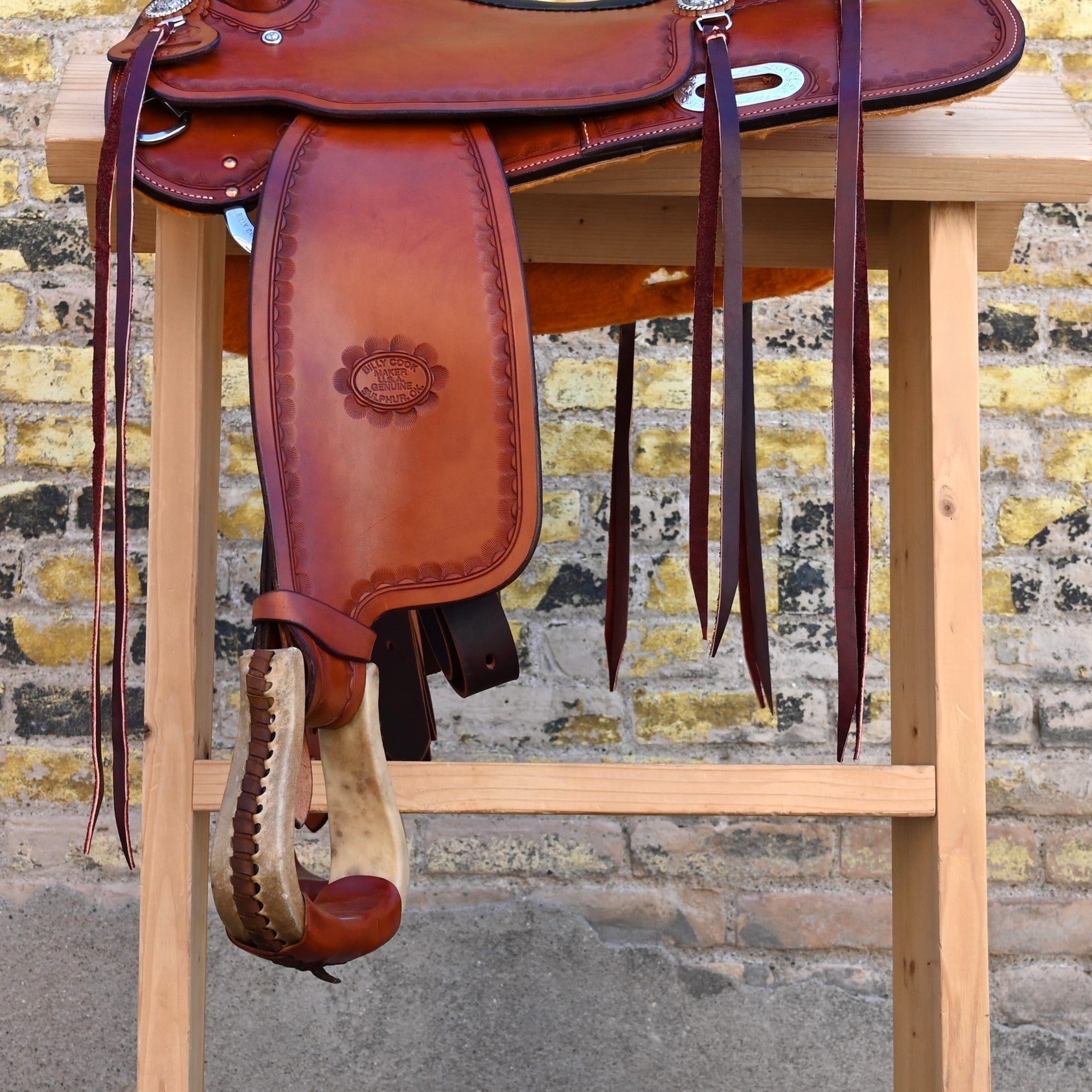 View of Billy Cook 16" Russet Trail Saddle with large camouflage border tooling