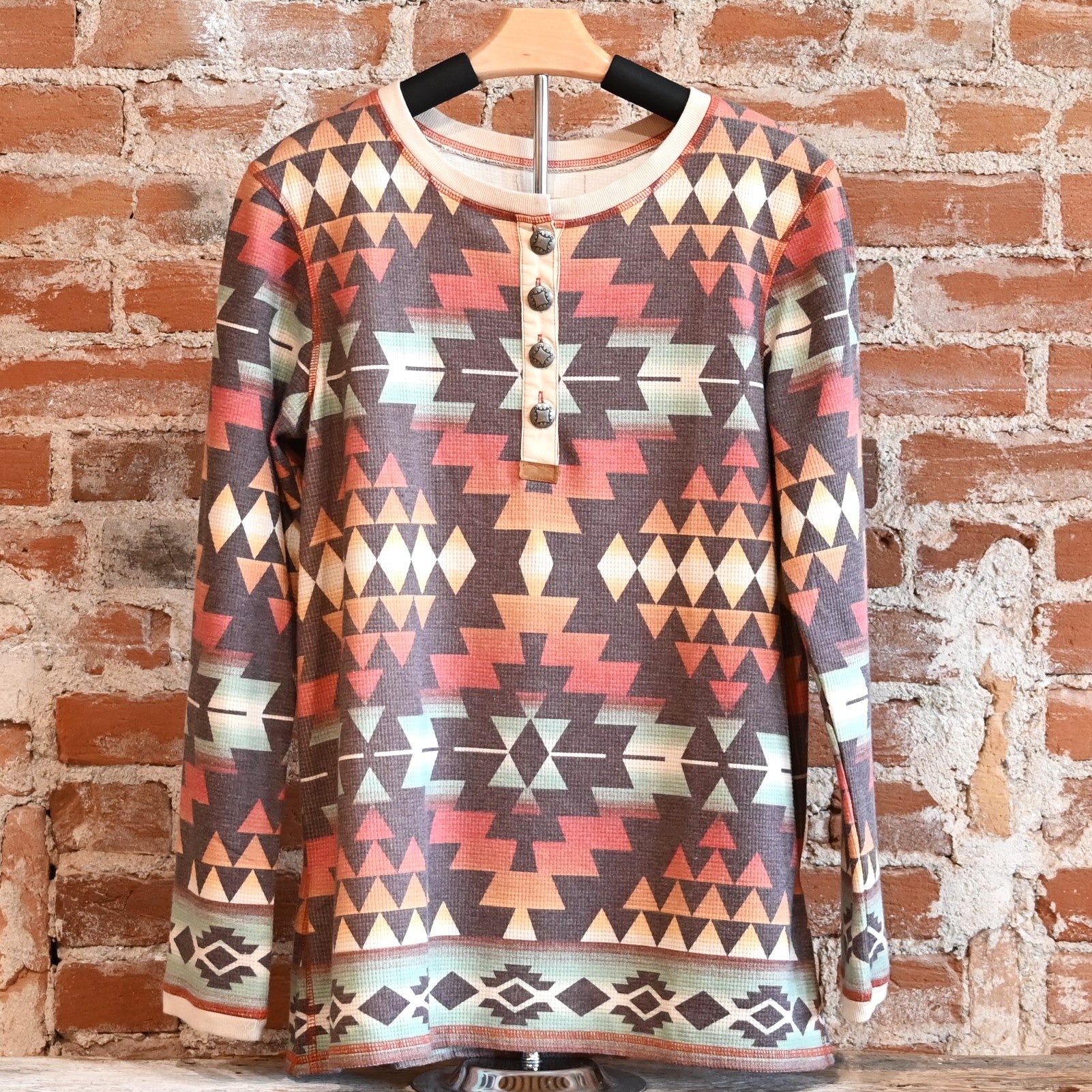 View of Double D Ranch Cowboy Bedroll Top featuring custom geometric print in autumn hues