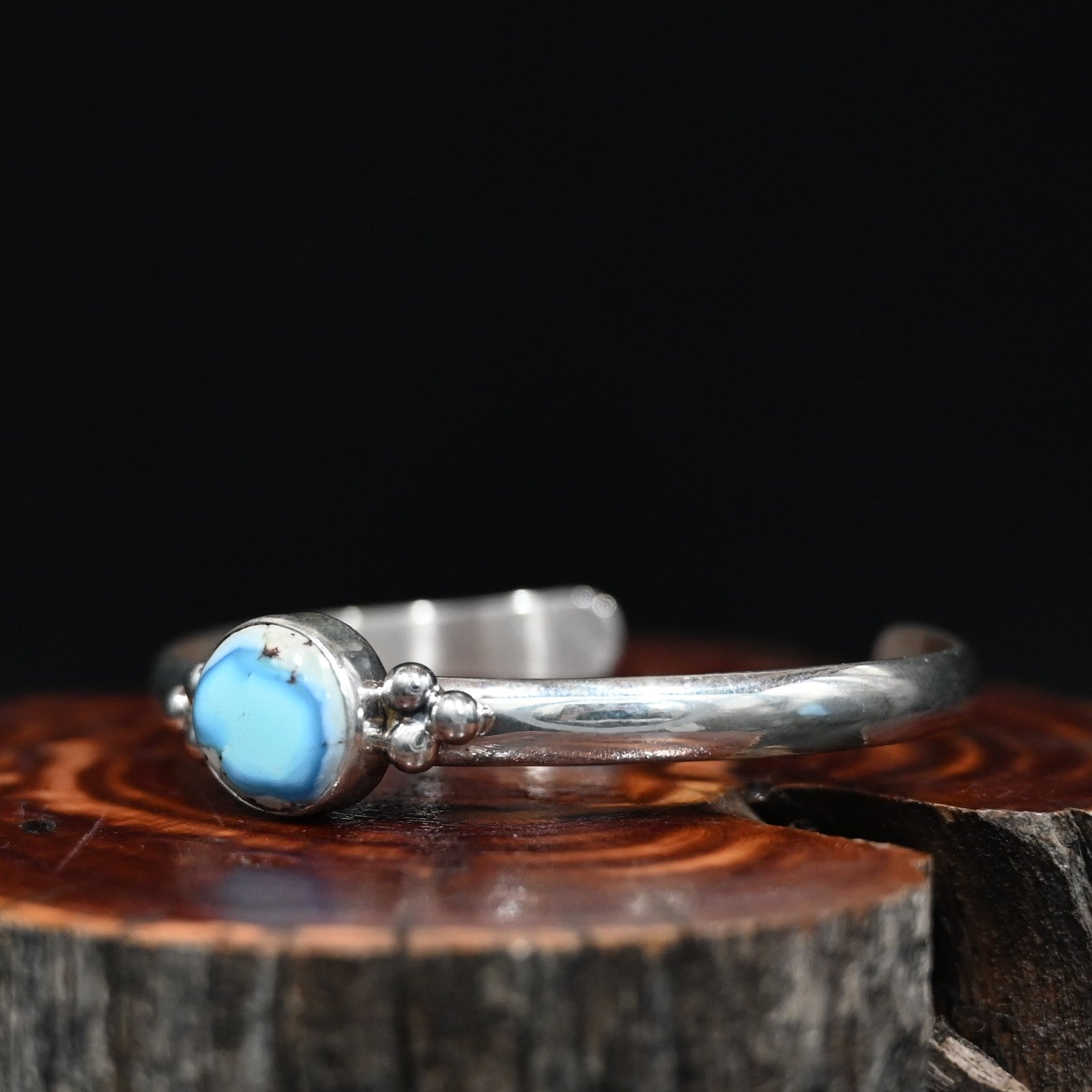 View of Sunwest Silver Paul Livingston Golden Hills One Stone Cuff featuring a light blue Golden Hills turquoise stone set in sterling silver