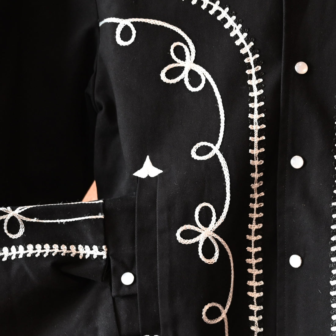 View of Rockmount vintage black gabardine bolero jacket with embroidery and snaps