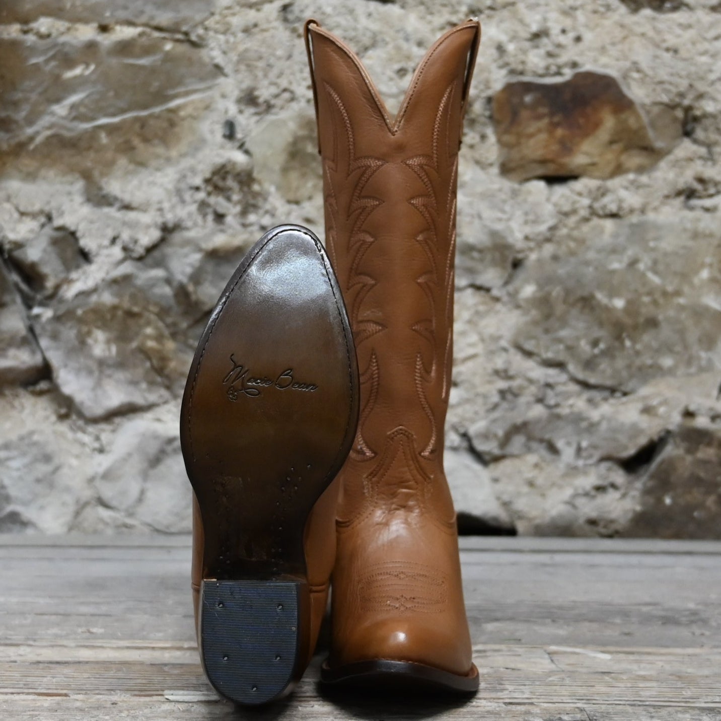 View of Macie Bean 15″ “Elle On Wheels” boot in tan Telluride leather with almond toe and City Girl heel