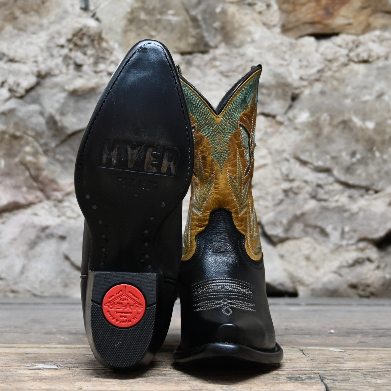 View of Hyer NANETTE 9" boots showcasing black cowhide vamp and sunflower vintage goat top with butterfly inlay, fashion snip toe, and leather stacked heel