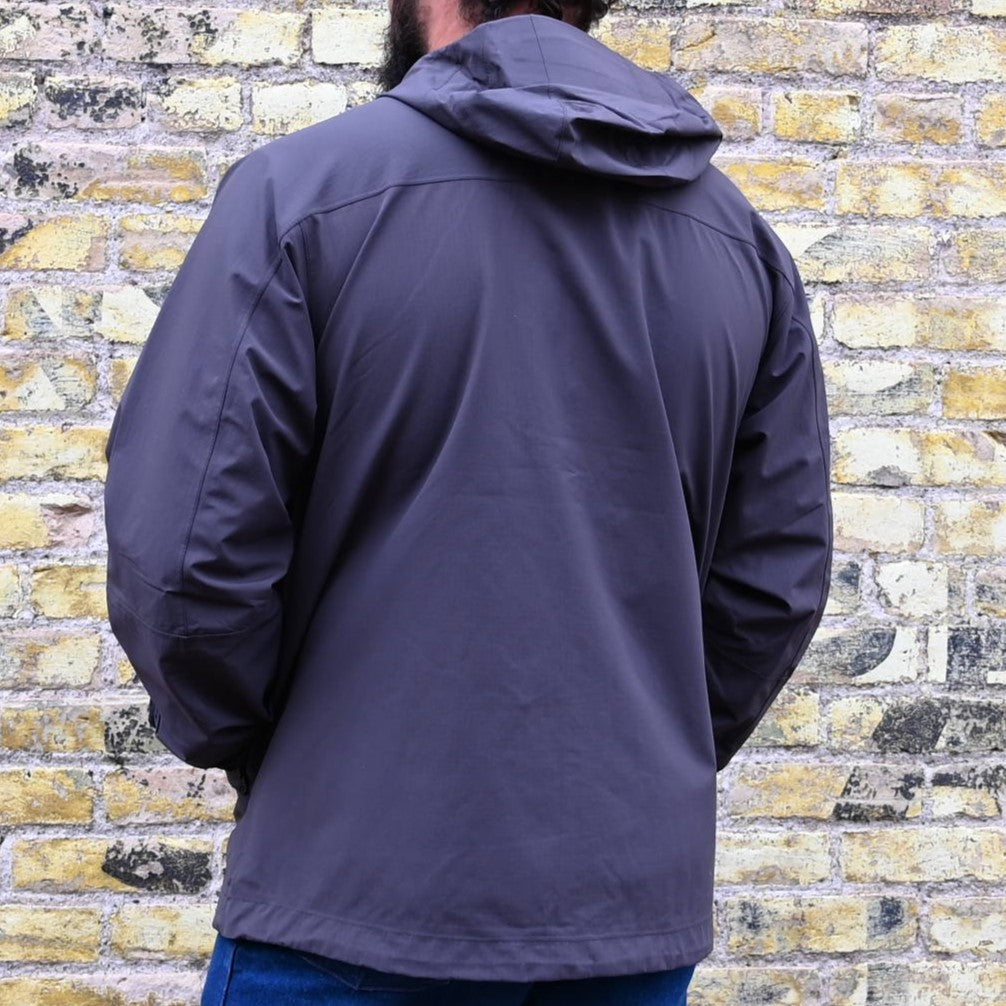 View of Filson Swiftwater Rain Jacket in Raven, showcasing its lightweight design and adjustable features