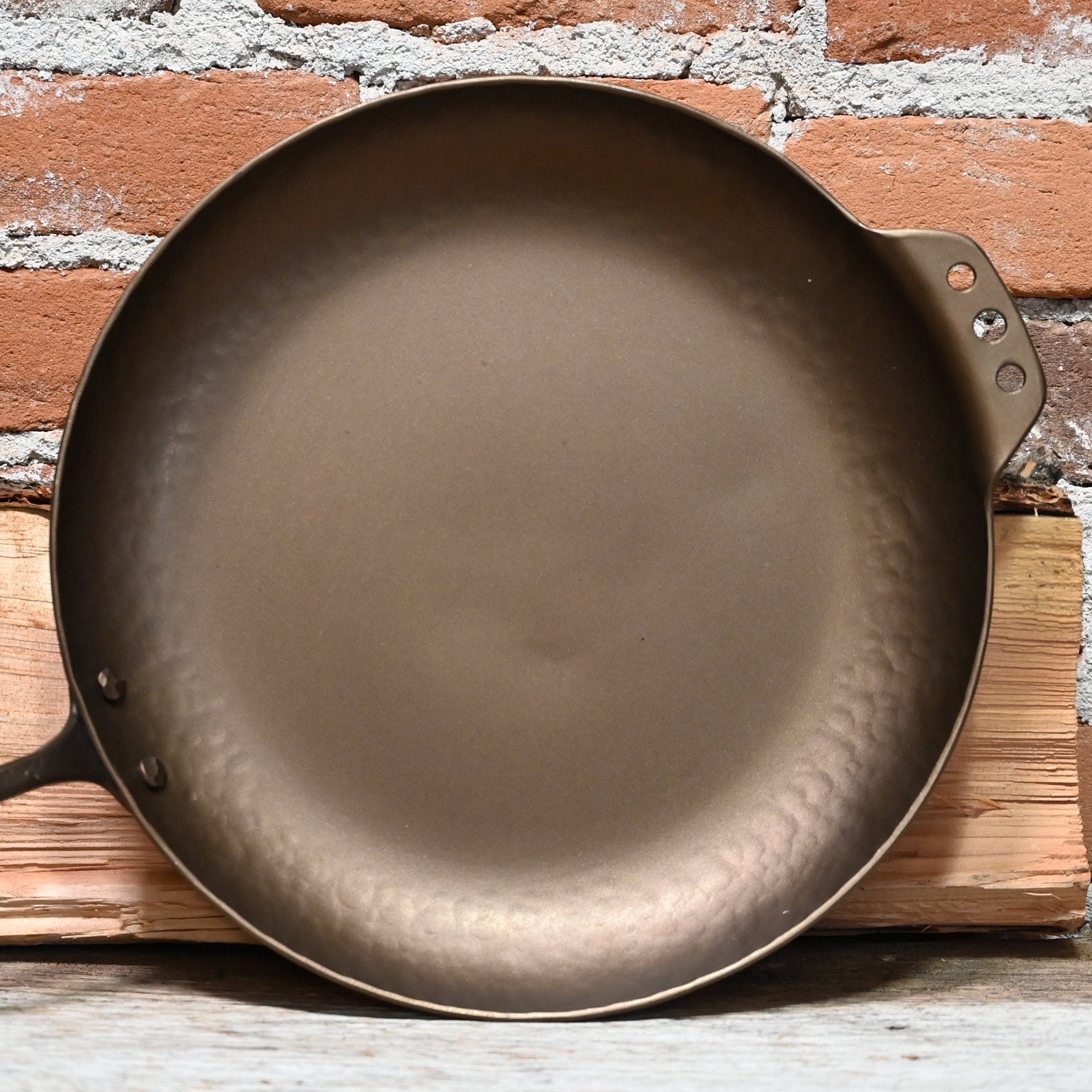 View of Smithey 12" Carbon Steel Farmhouse Skillet – Hand-forged pan with hammered handle and pre-seasoned interior