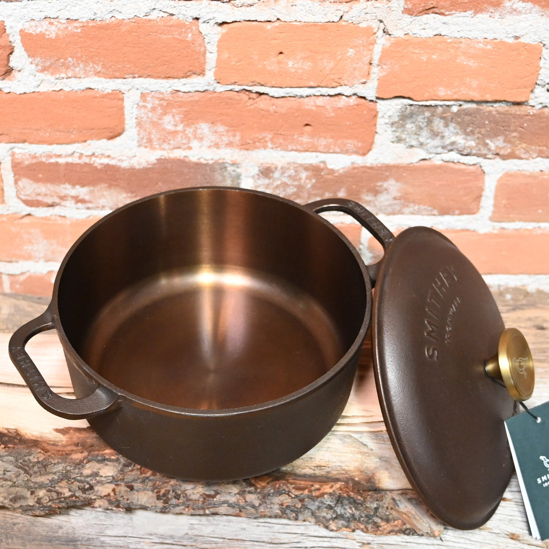 View of Smithey Ironware 5.5 qt Dutch Oven with polished interior and ergonomic handles