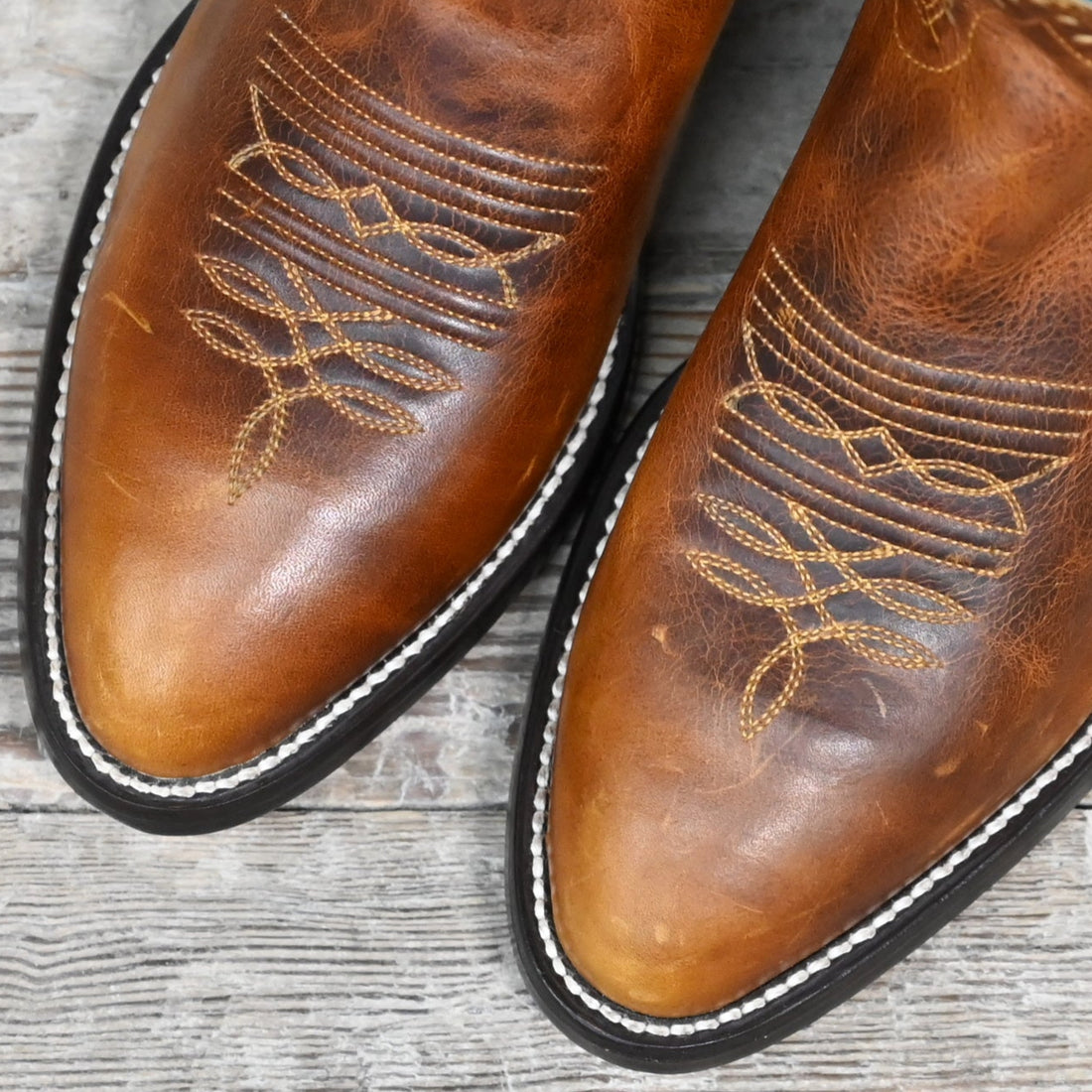 View of Hondo 14" cowboy boot with turquoise top, tan waxy cowhide vamp, and tight round toe