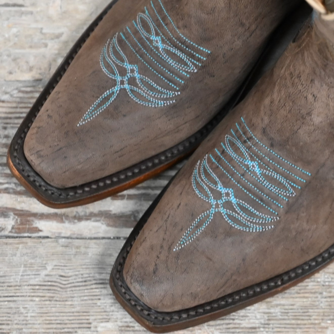 Rios of Mercedes ladies 8″ boot with chocolate-colored top, turquoise stitching, and cutter snip toe