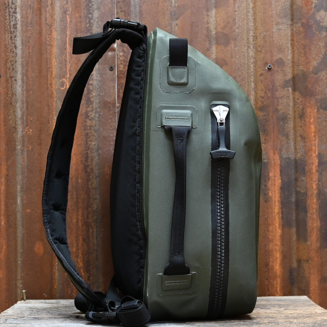 View of Filson Dry Sling Pack in Green featuring waterproof construction and ergonomic design