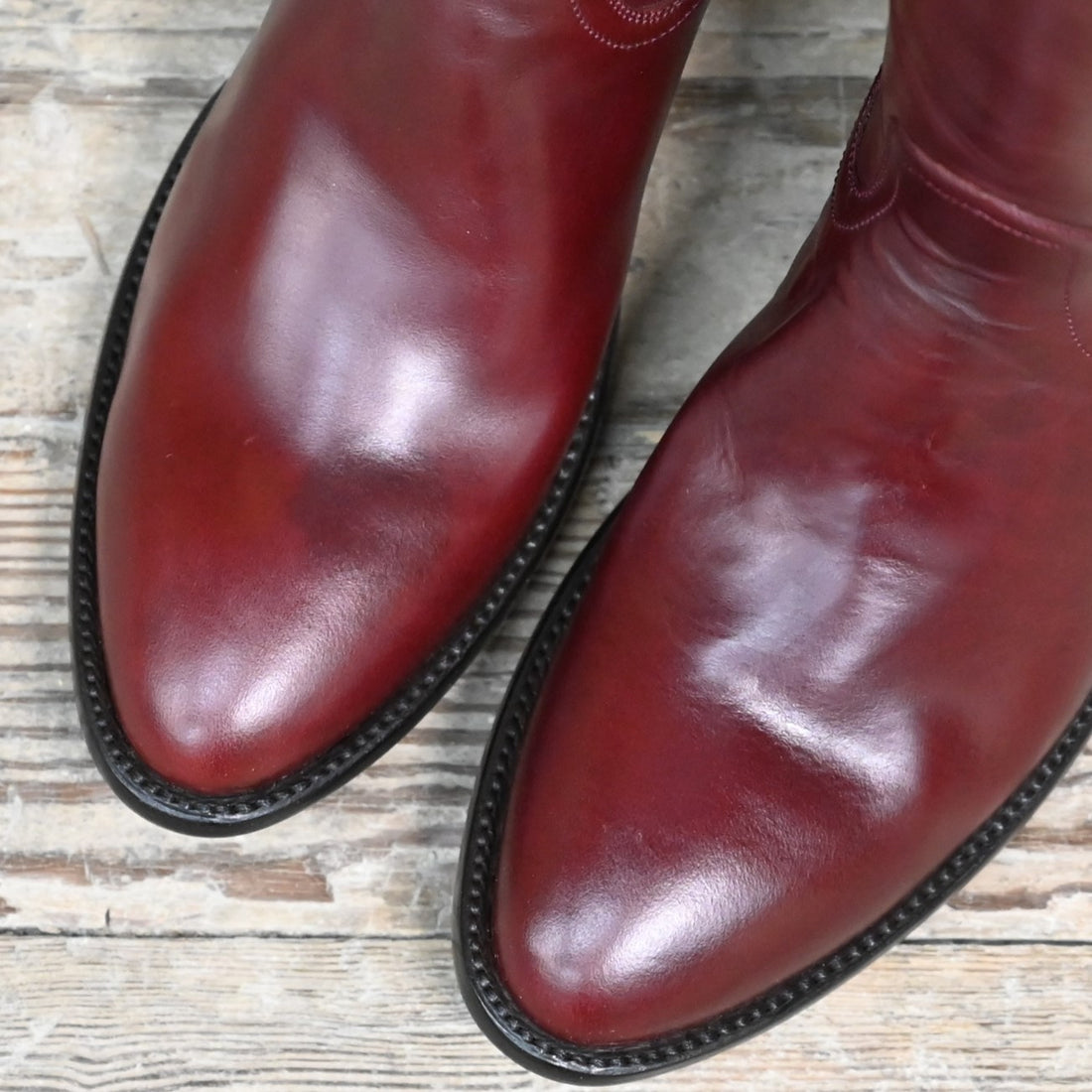 View of Stallion Ladies 16" Burnt Red Calf English High Boot with B toe and covered piping