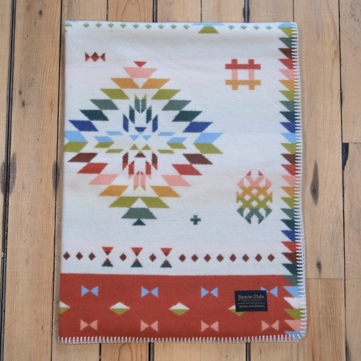 Pendleton Wild Blooms child-sized wool blanket in White/Coral Multi floral design.