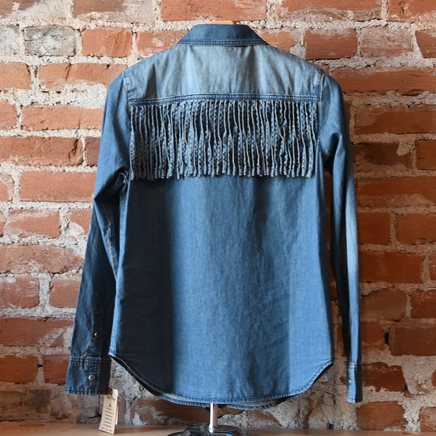 Washed blue denim Hart Shirt by Tasha Polizzi with self-fringe along front and back yokes