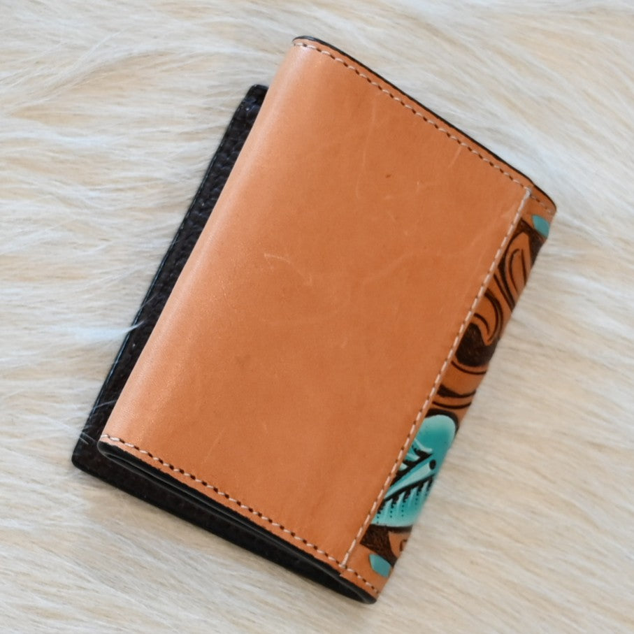 View of Back of Floral and Turquoise Trifold Wallet with Intricate Blue and Leather Design.