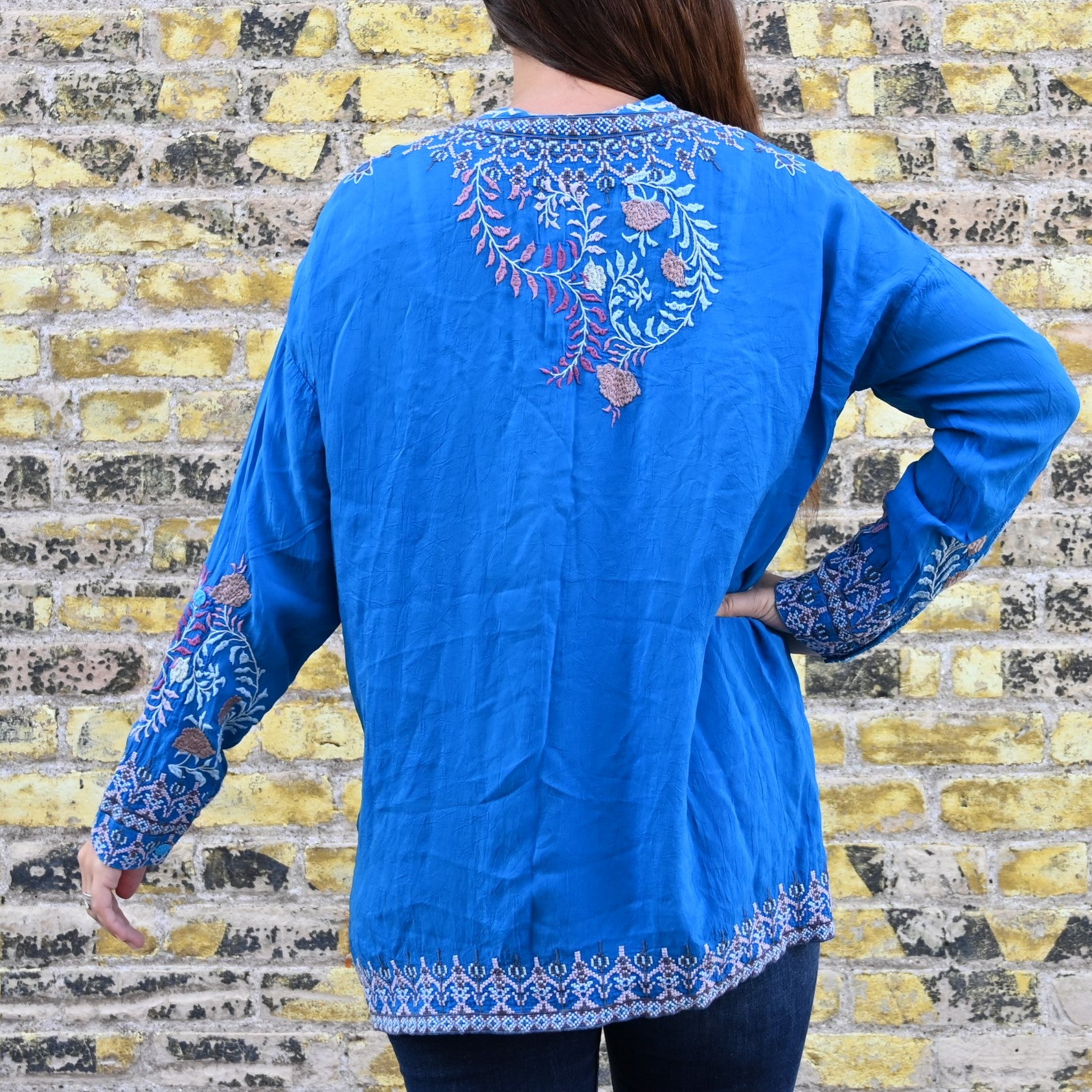 View of Johnny Was Sundae Tunic in Mediterranean Blue with floral embroidery and henley neckline