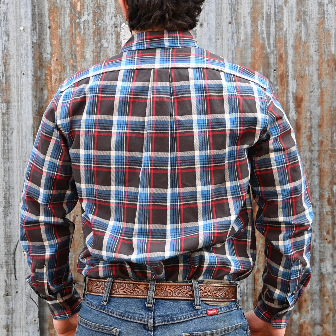 View of Filson Light Weight Alaskan Guide Shirt featuring button-front closure, chest pockets, and plaid pattern