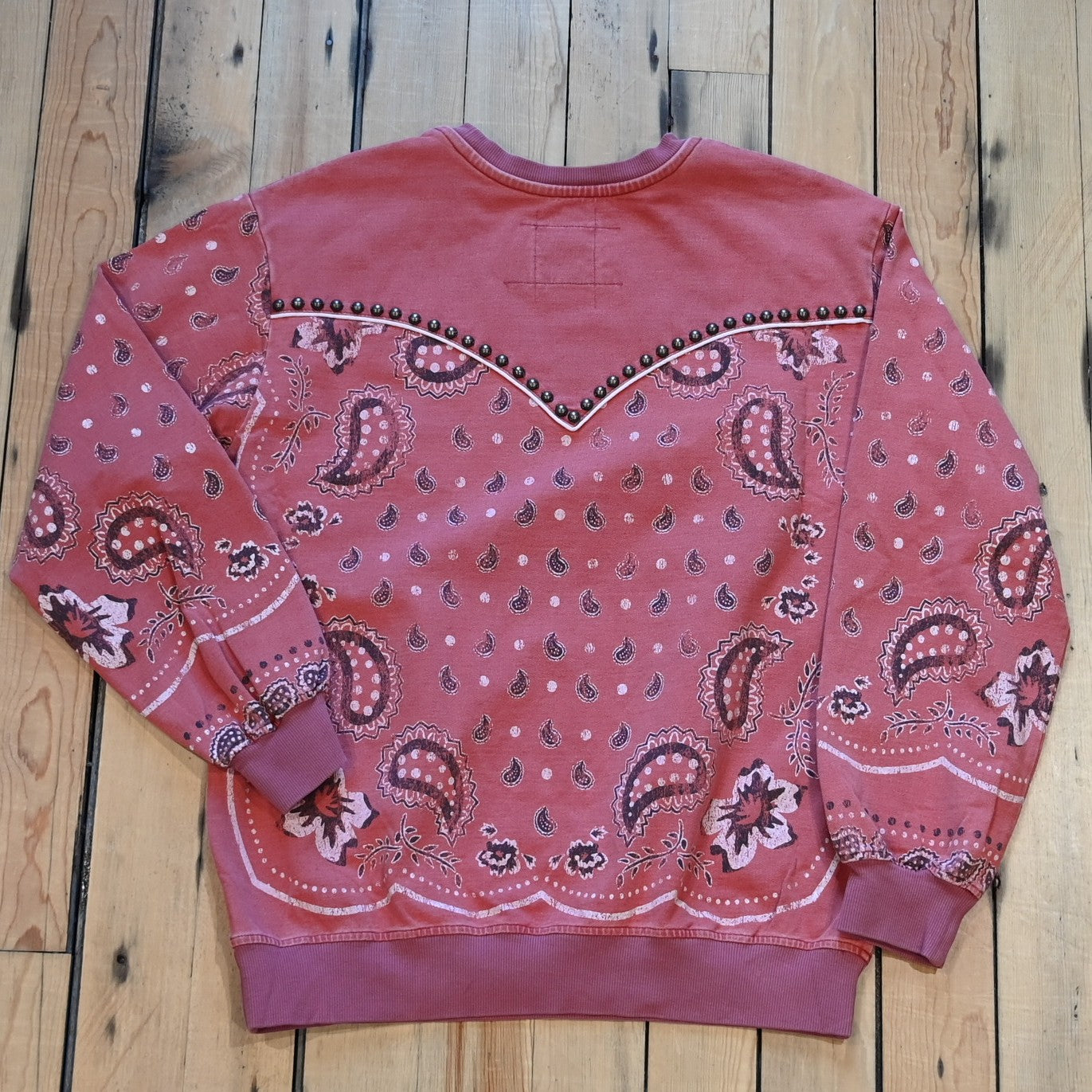 View of Ladies bandana sweatshirt in muted mahogany with embroidered and studded bandana print