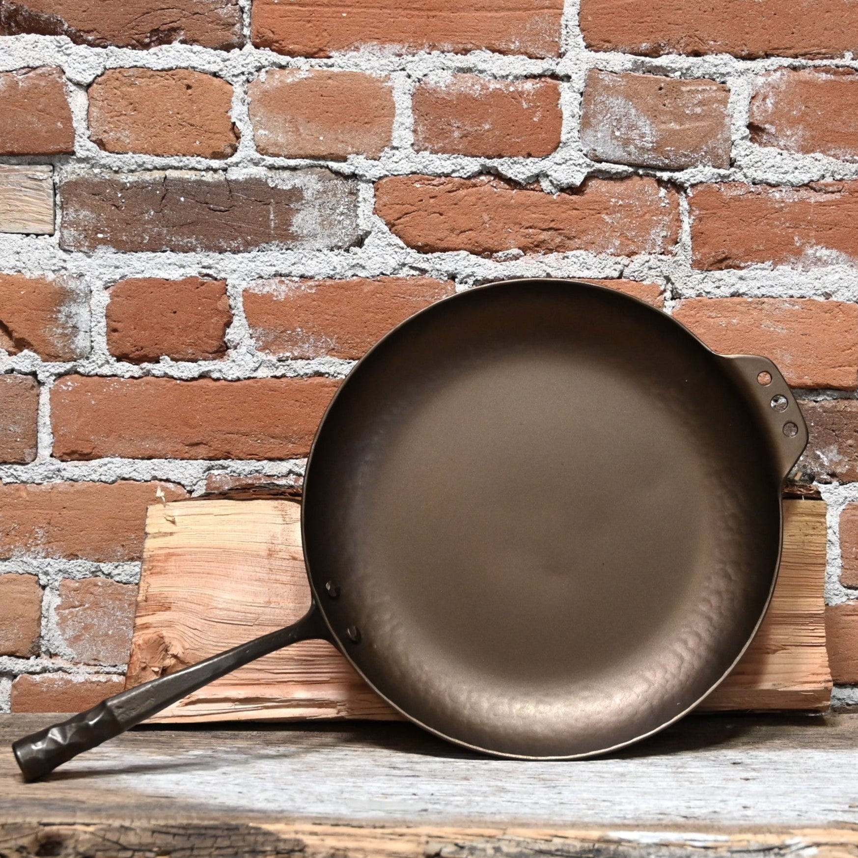 View of Smithey 12" Carbon Steel Farmhouse Skillet – Hand-forged pan with hammered handle and pre-seasoned interior