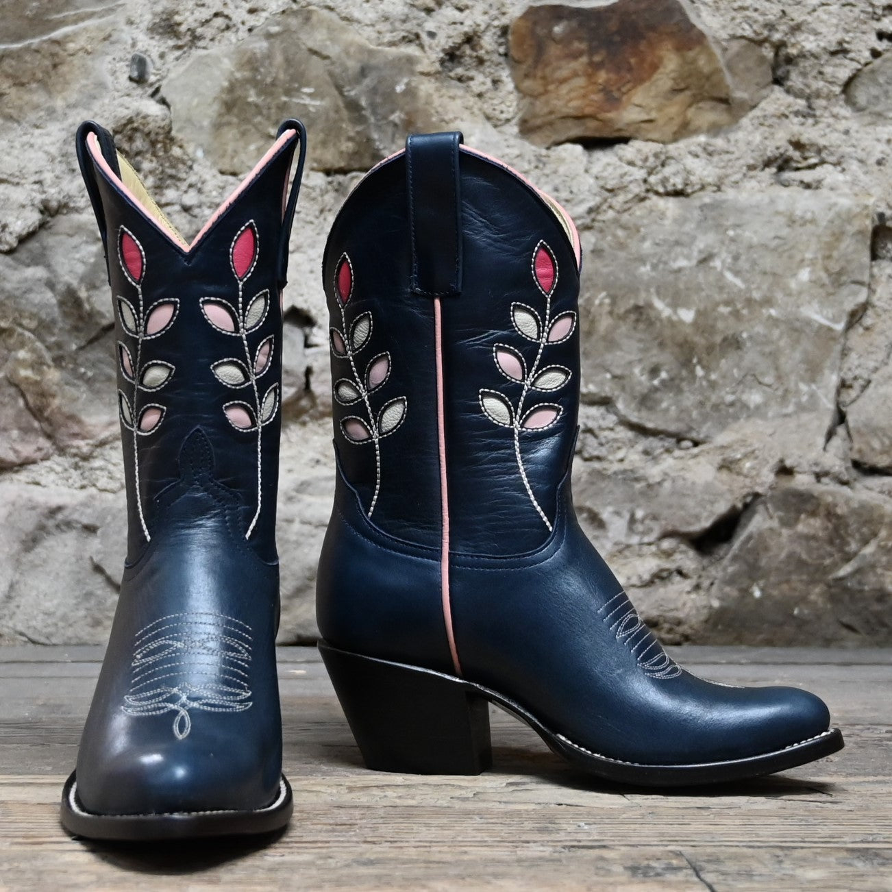View of Macie Bean 10″ boot with navy glazed cowhide, berry inlays, almond toe, and cowgirl heel