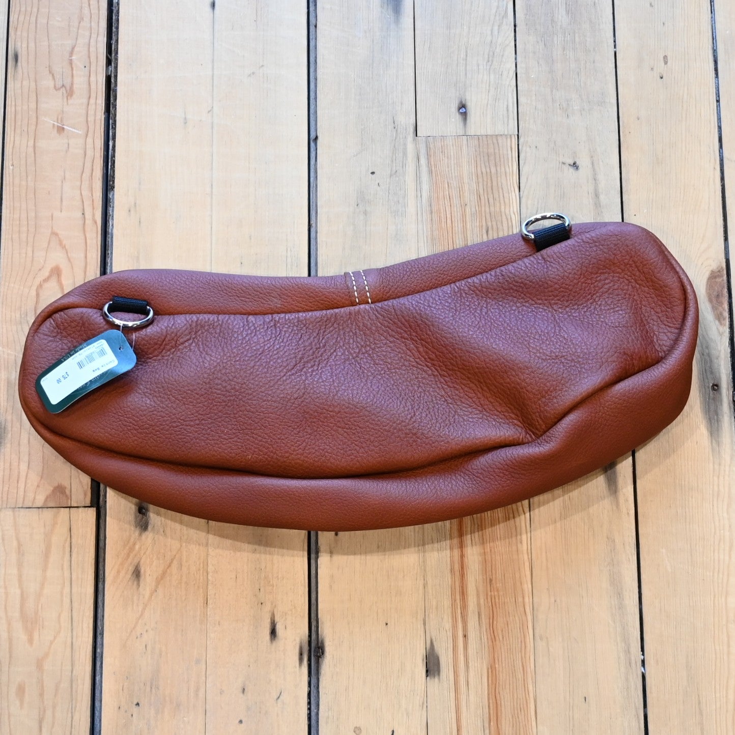 View of Berlin Custom Leather chap leather cantle bag with brass zipper and saddle loops