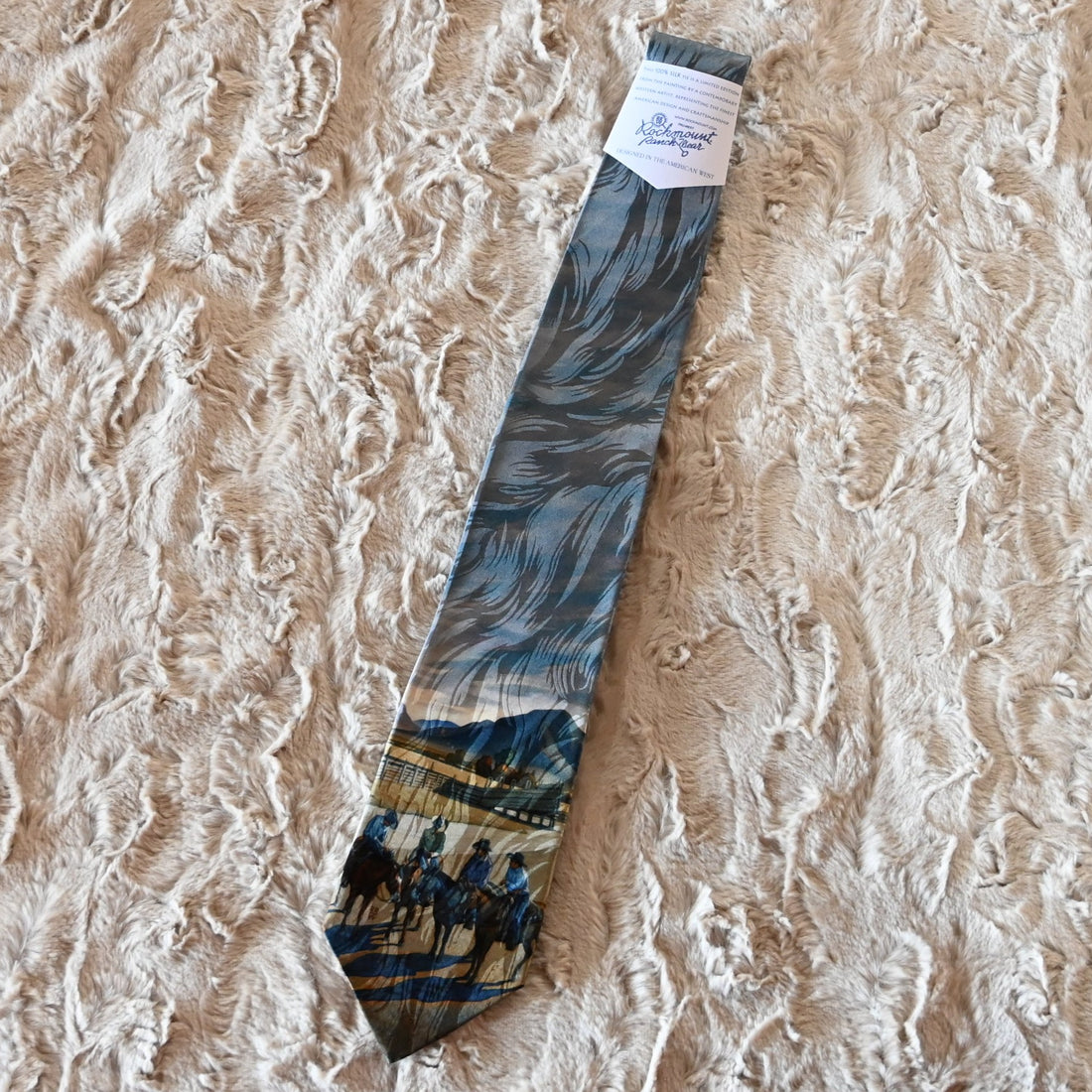 View of Rockmount “Cattleman Conference” silk tie featuring cowboy scene by Howard Post