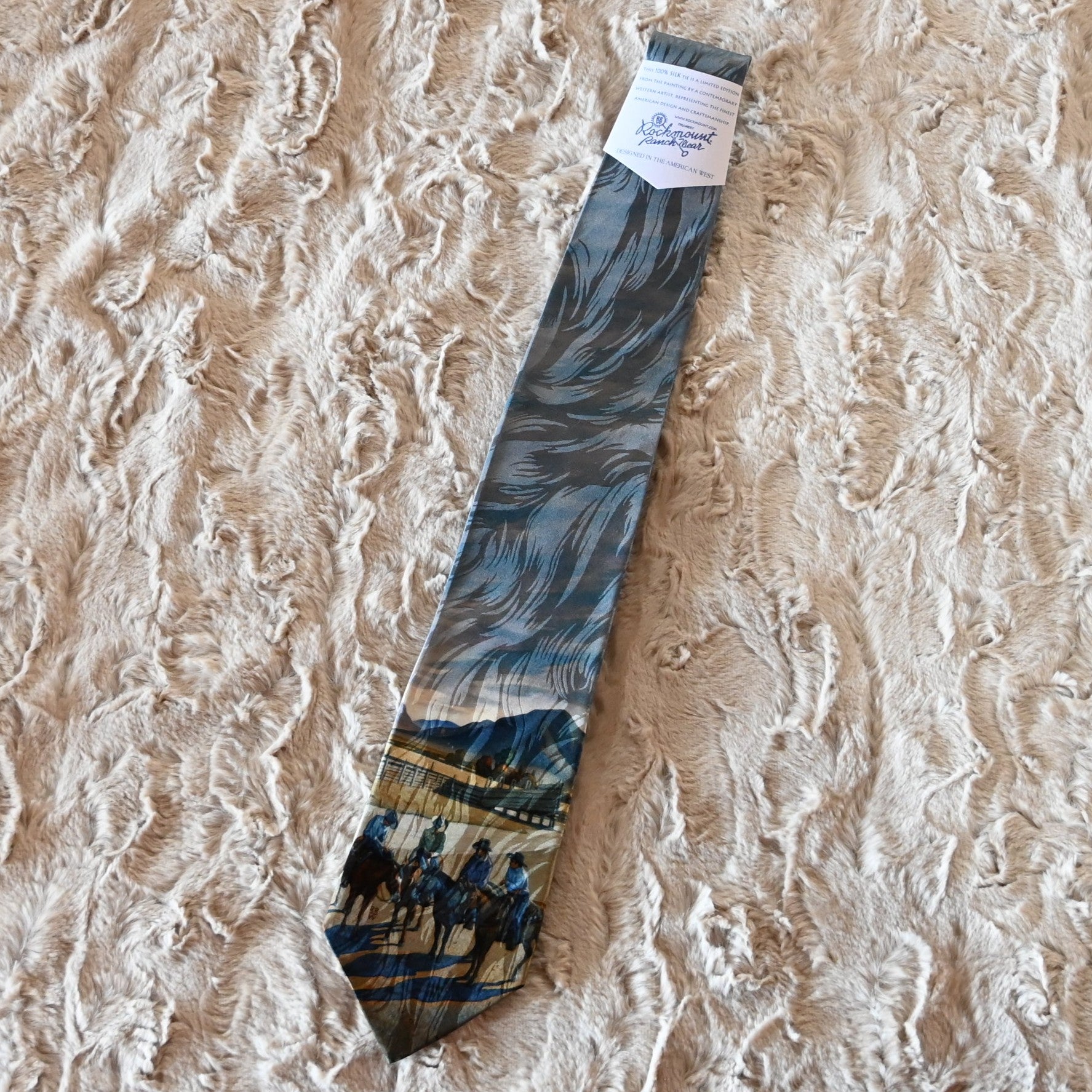 View of Rockmount “Cattleman Conference” silk tie featuring cowboy scene by Howard Post