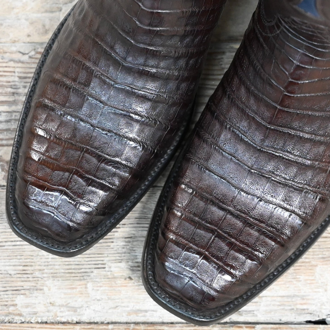 View of Stallion Men’s 13" boot in chocolate calf with Fleur-de-Lis inlays, semi square toe, and Western heel