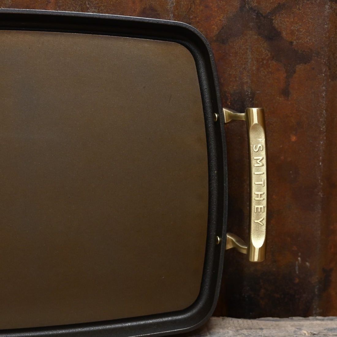 View of Smithey Ironware Double Burner Griddle with polished surface and dual riveted handles