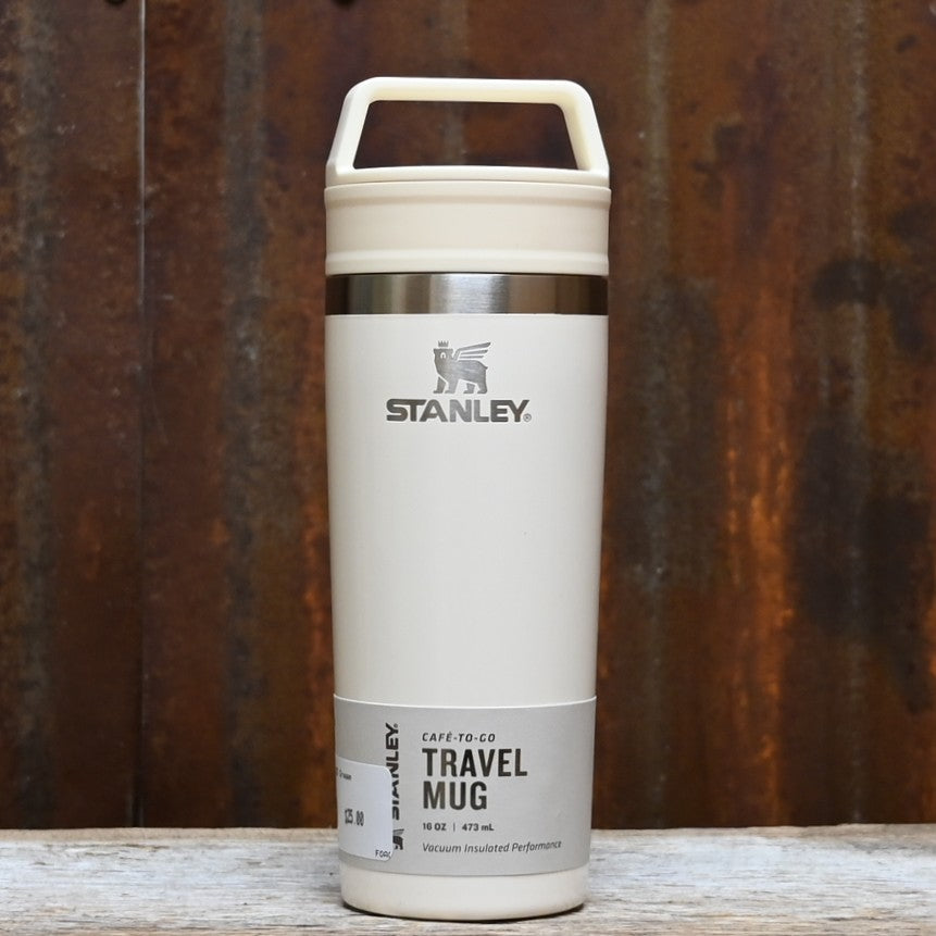 Stanley cream gloss 16 oz travel mug with integrated handle and two‑piece sip lid.