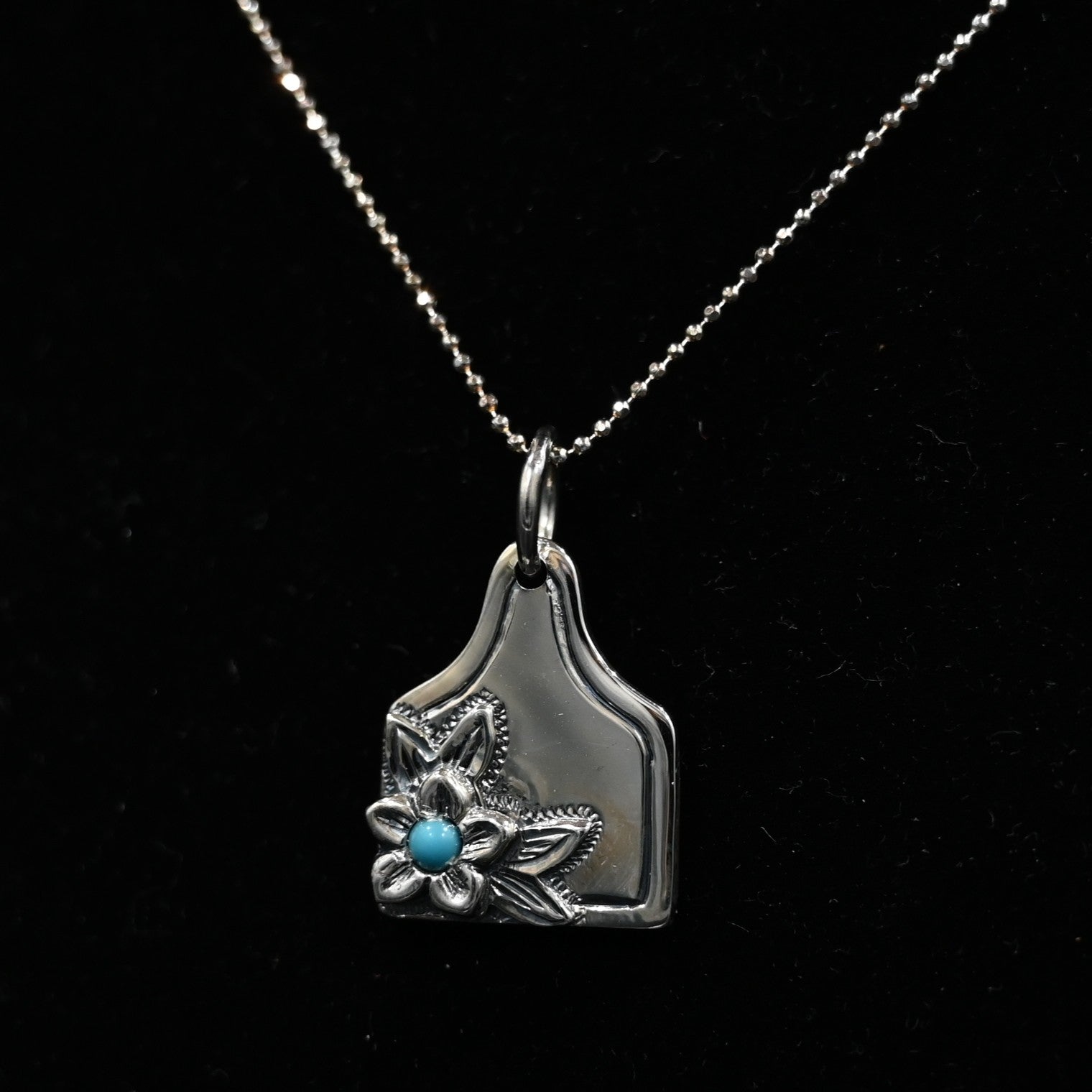 Vogt Turquoise Blossom eartag pendant in sterling silver with turquoise stone and floral motif