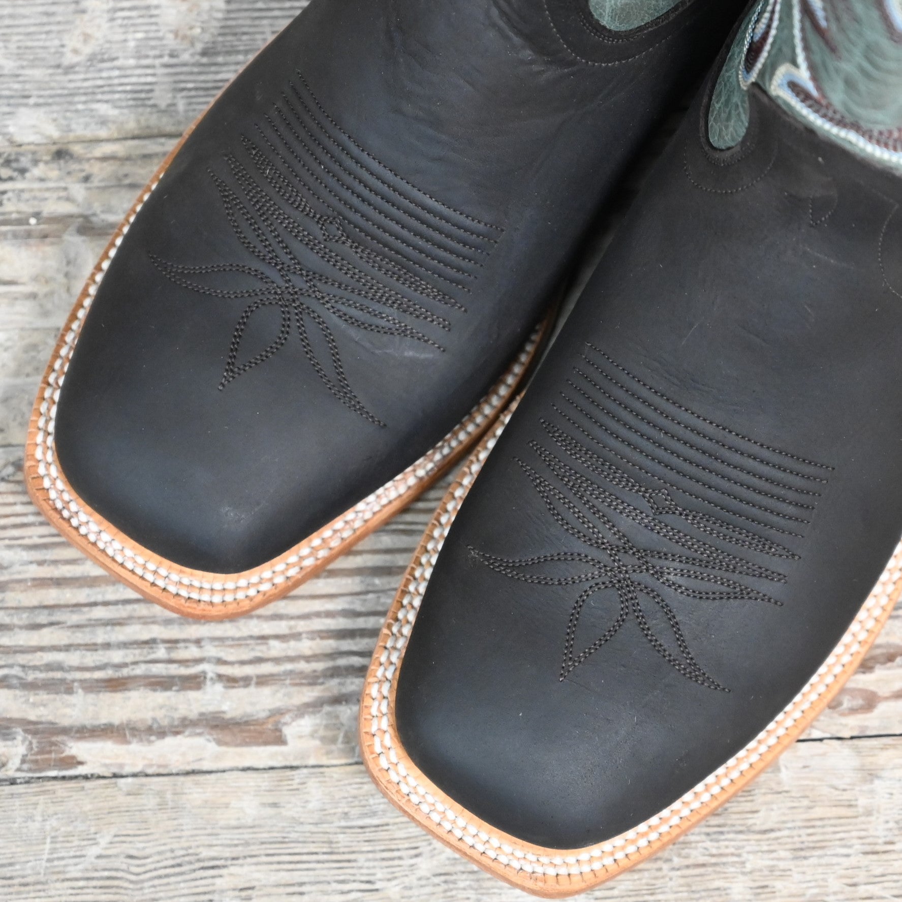 View of Hyer CODELL DENIM 13" boots showcasing denim blue Bravo goat leather shaft and chocolate mule cowhide vamp with broad square toe and Stockman block heel