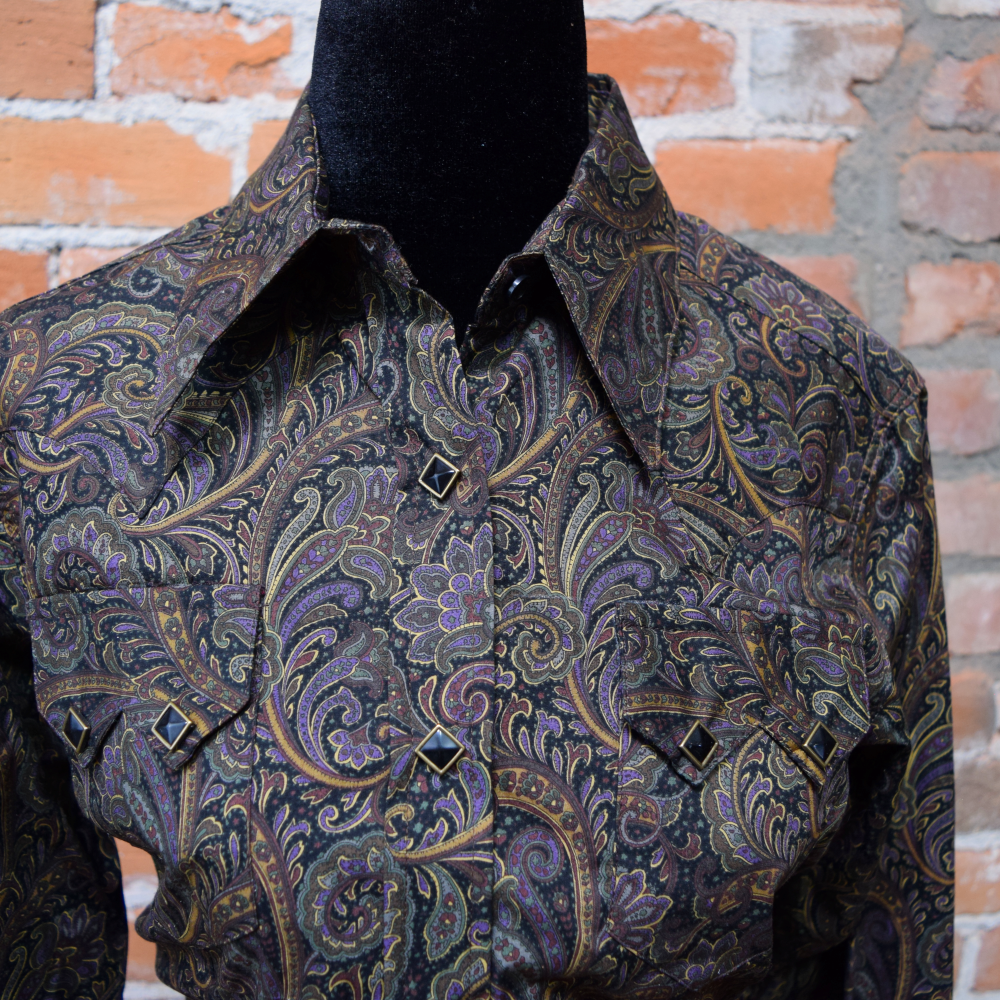 View of Rockmount women’s paisley cotton Western shirt with sawtooth pockets and diamond snap closures