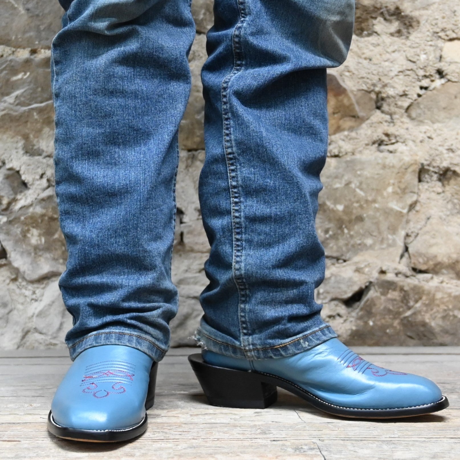View of Atomic 79 exclusive Hondo Bronc Boot with burgundy top, sky blue vamp, French square toe, and spur lip