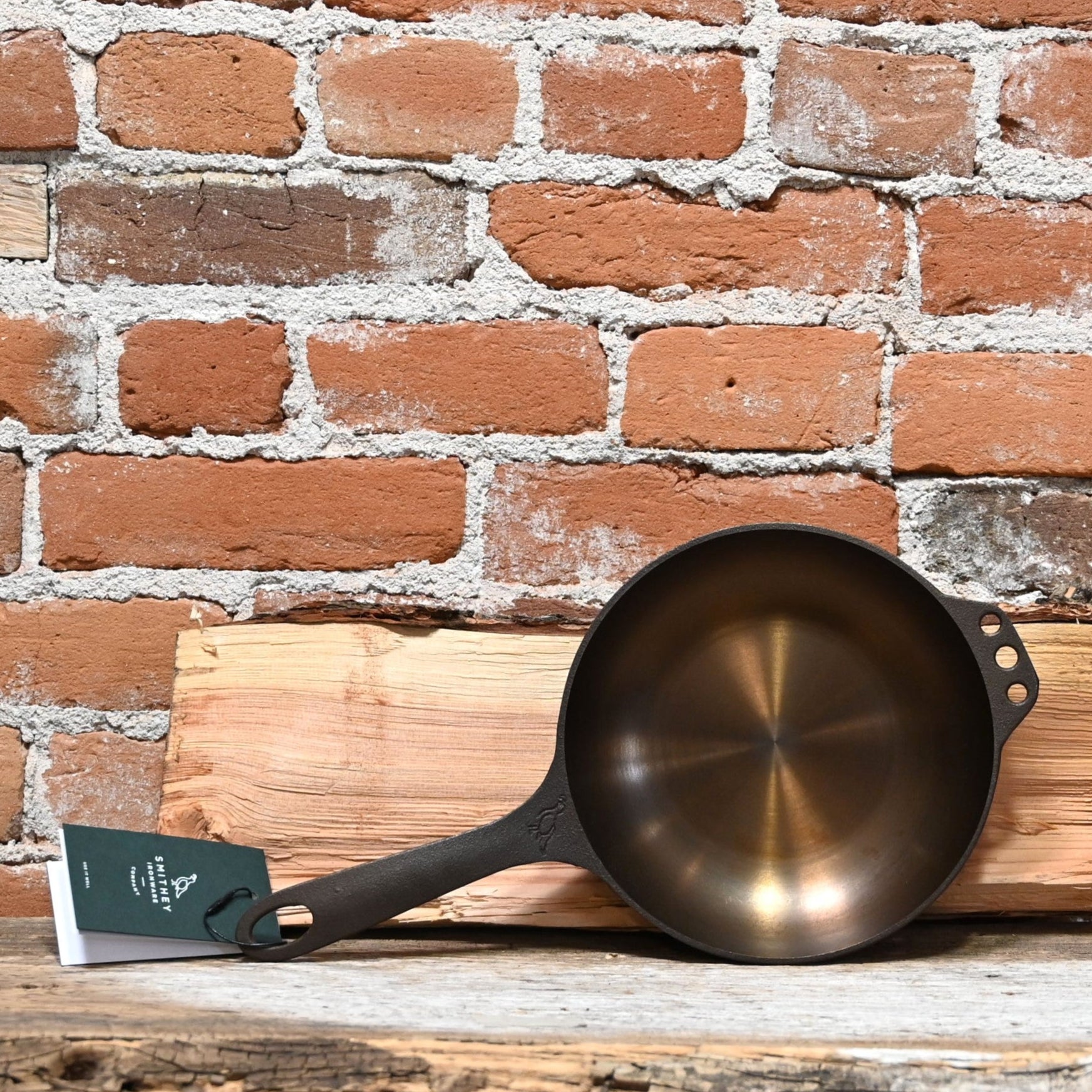 View of Smithey Ironware No. 8 Cast Iron Chef Skillet with polished interior and ergonomic handle