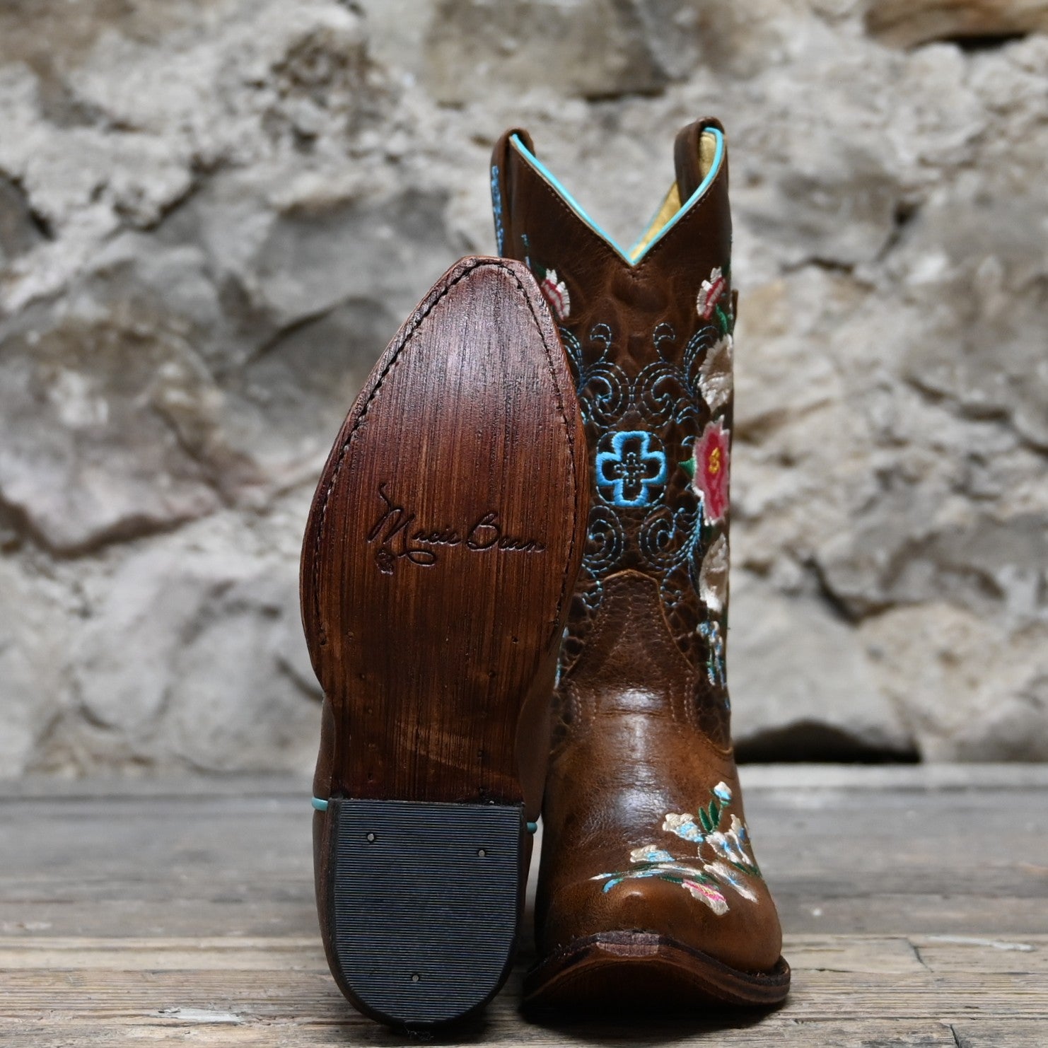 View of Macie Bean youth Honey Bunch boot with floral top, pointed toe, and cowgirl heel