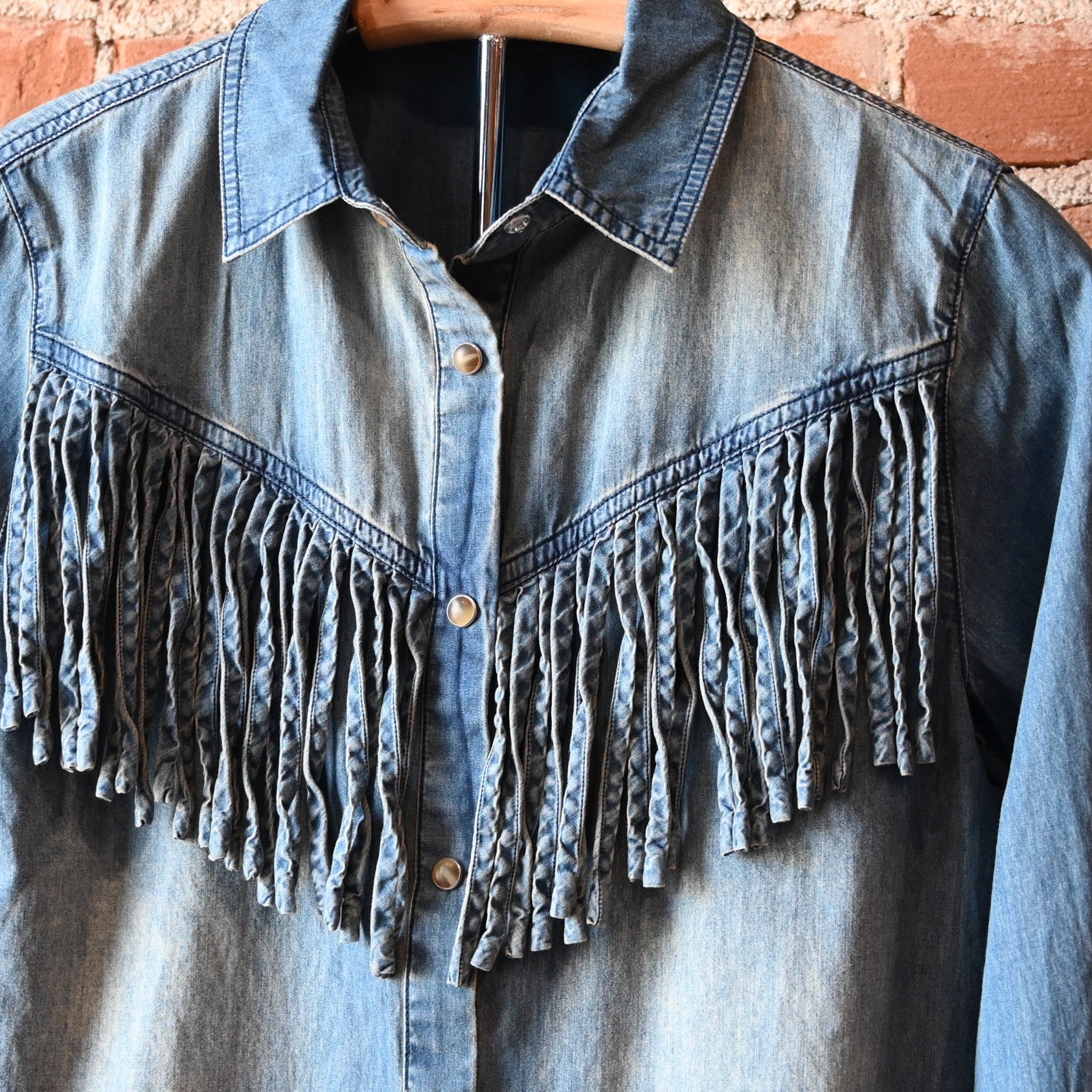 Washed blue denim Hart Shirt by Tasha Polizzi with self-fringe along front and back yokes
