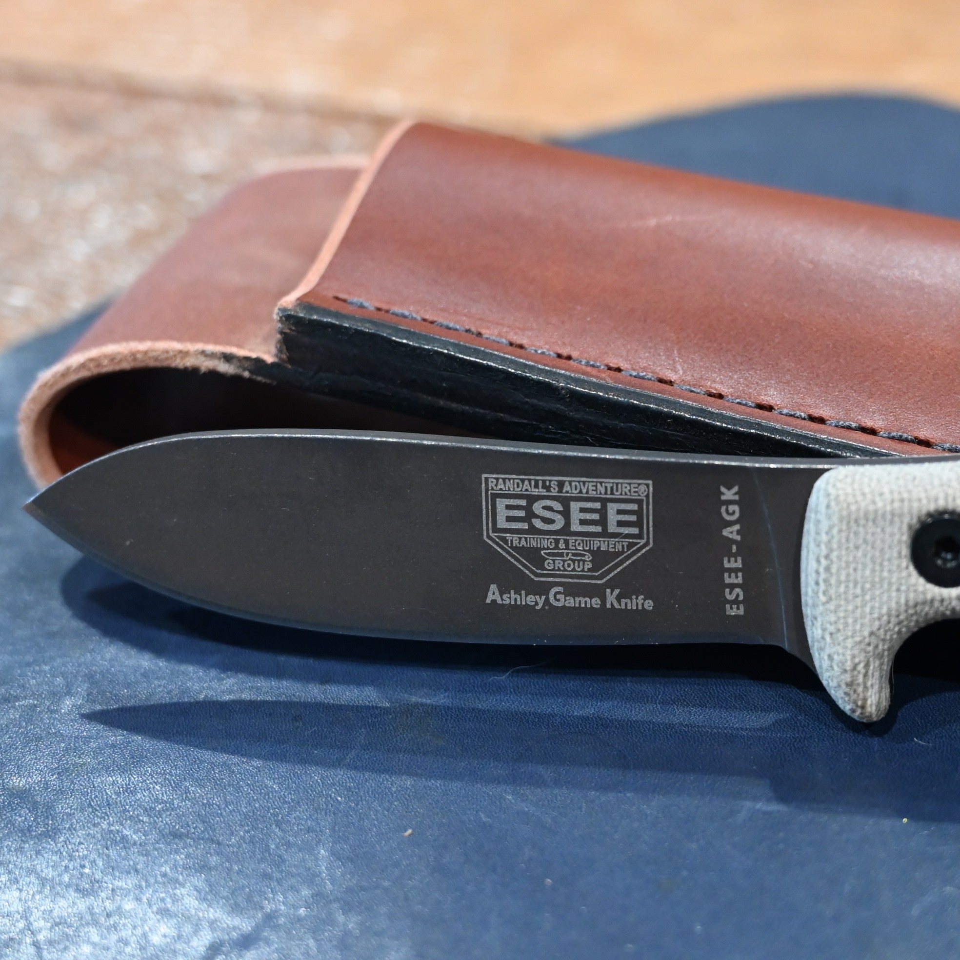 ESEE Ashley Emerson hunting knife with 1095 carbon steel blade and leather sheath, 2025 edition